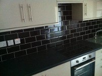 Kitchen tiling using black metro tiles